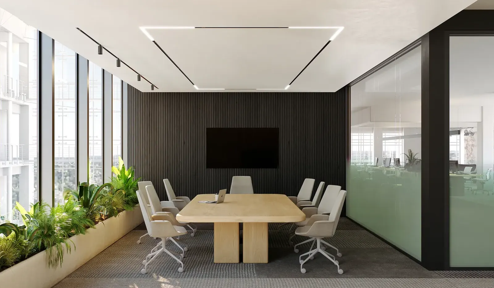 Conference room with a rectangular lighting framework recessed into the ceiling, track spotlights along its rails, above a light wood table